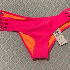 Neon pink swimsuit bottoms. Size medium